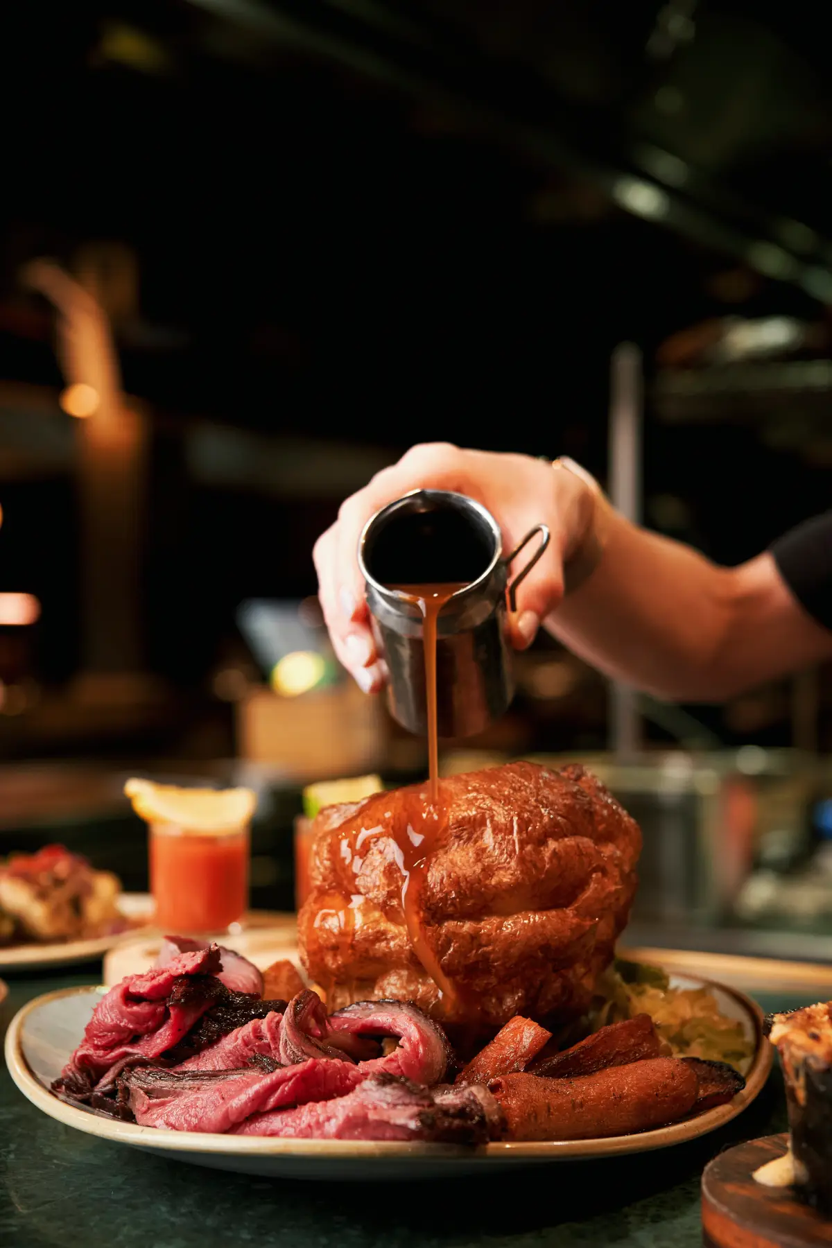 Fire-cooked Sunday roast at temper
